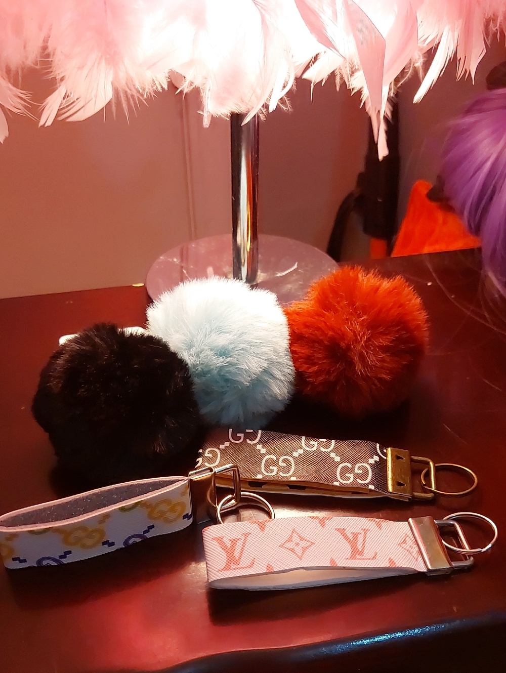 Designer Logo Wristlet Keychains with Pom Pom Charms